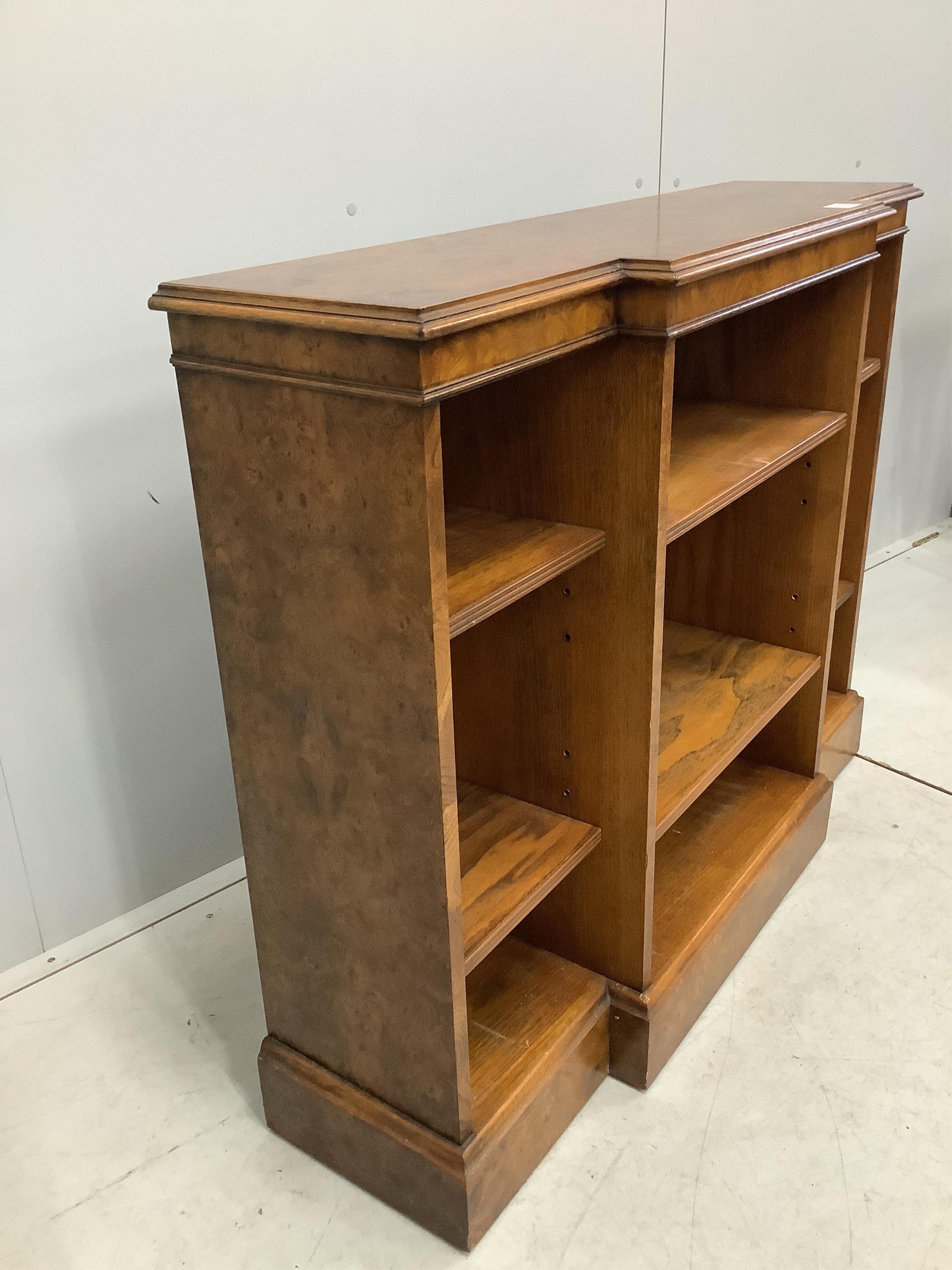 A Regency style banded burr elm dwarf breakfront bookcase, width 112cm, depth 32cm, height 91cm. Condition - good